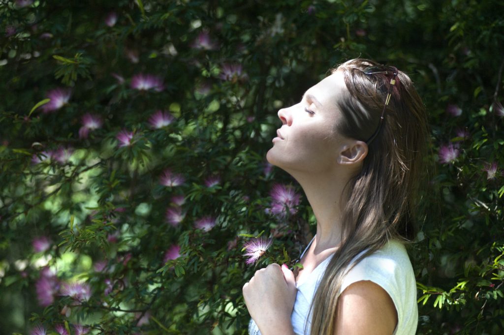 girl breathing in fresh air